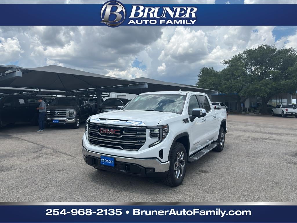 2026 GMC Sierra 1500 SLT in Summit White — front three-quarter view