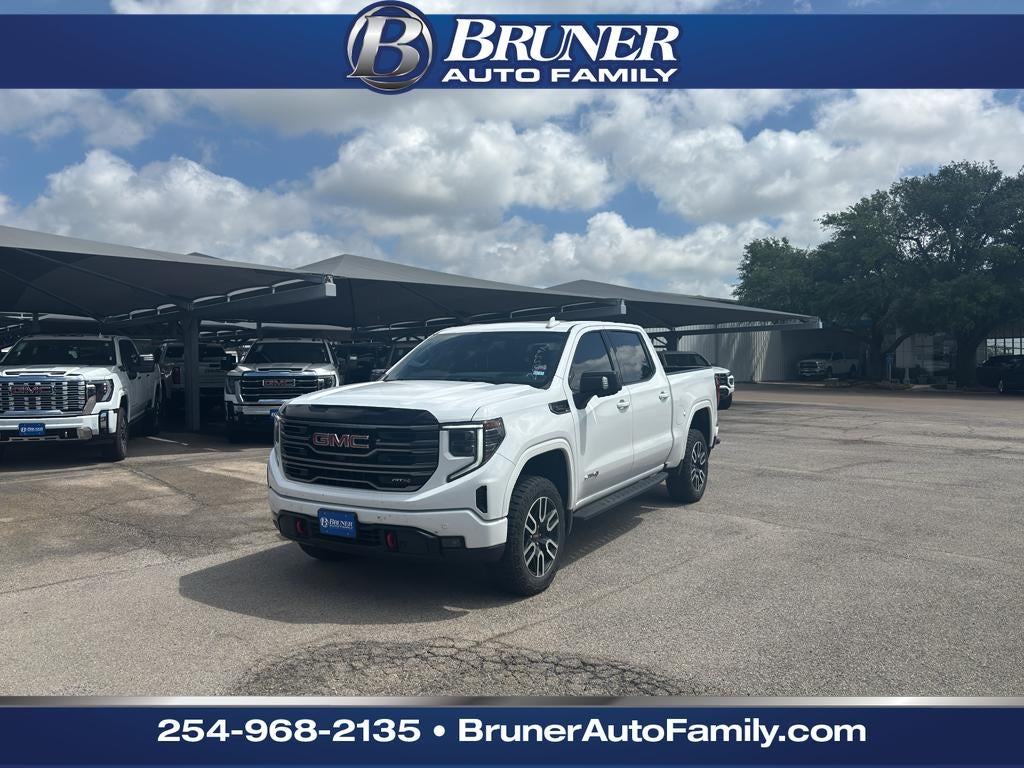 2025 GMC Sierra 1500 AT4 in Summit White — front three-quarter view