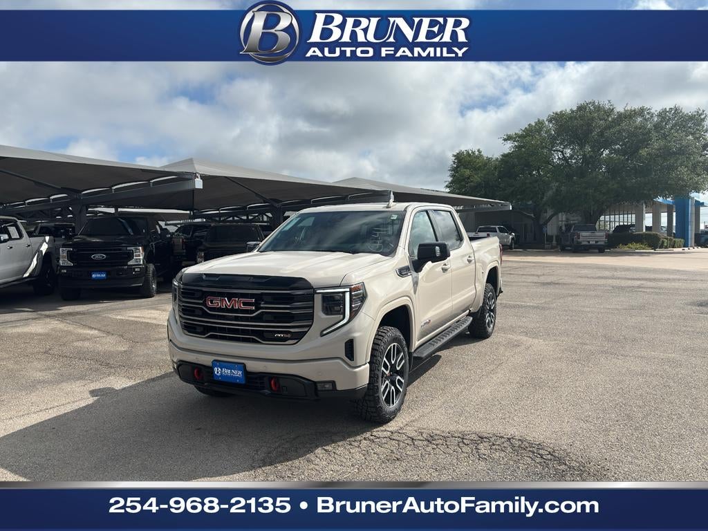 2026 GMC Sierra 1500 AT4 in Coastal Dune — front three-quarter view