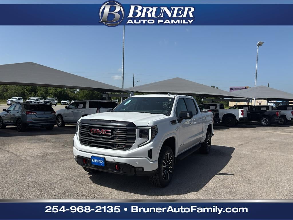 2026 GMC Sierra 1500 AT4 in Summit White — front three-quarter view