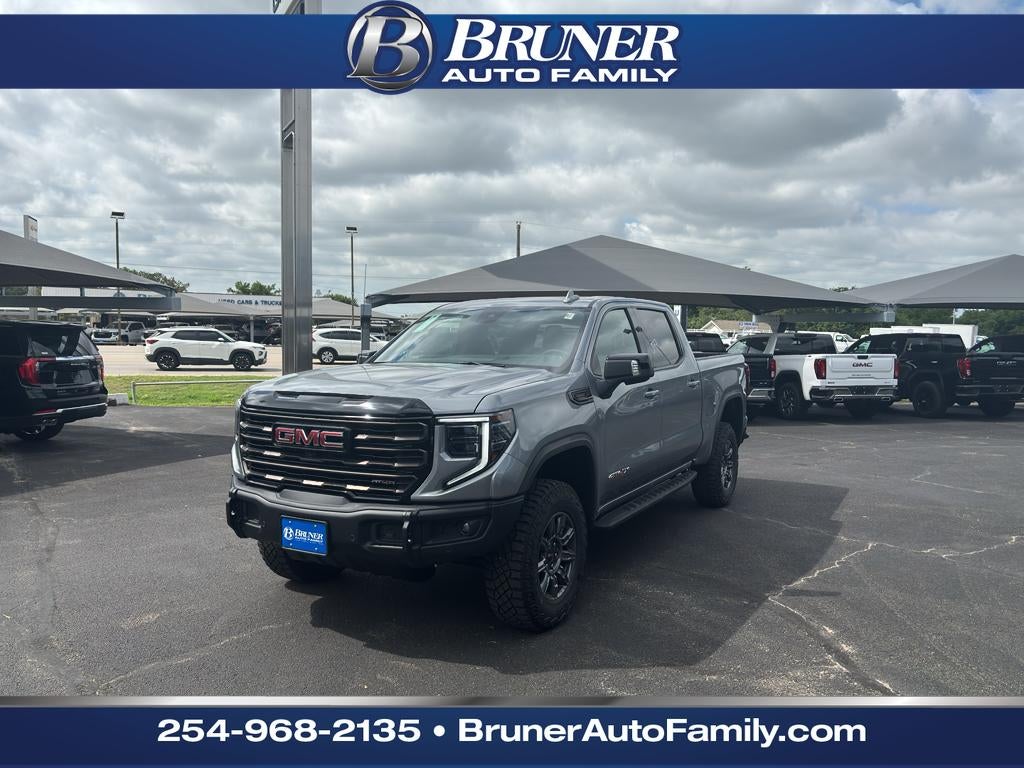 2026 GMC Sierra 1500 AT4X in Sterling Metallic — front three-quarter view