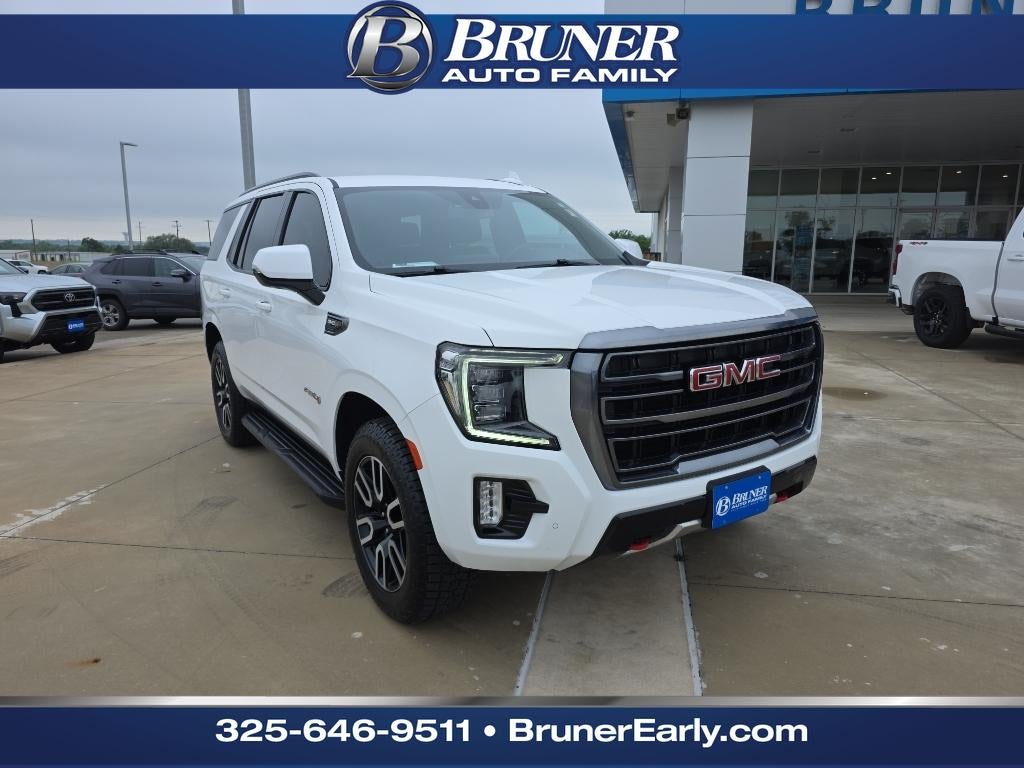 2022 GMC Yukon AT4 in Summit White — front three-quarter view