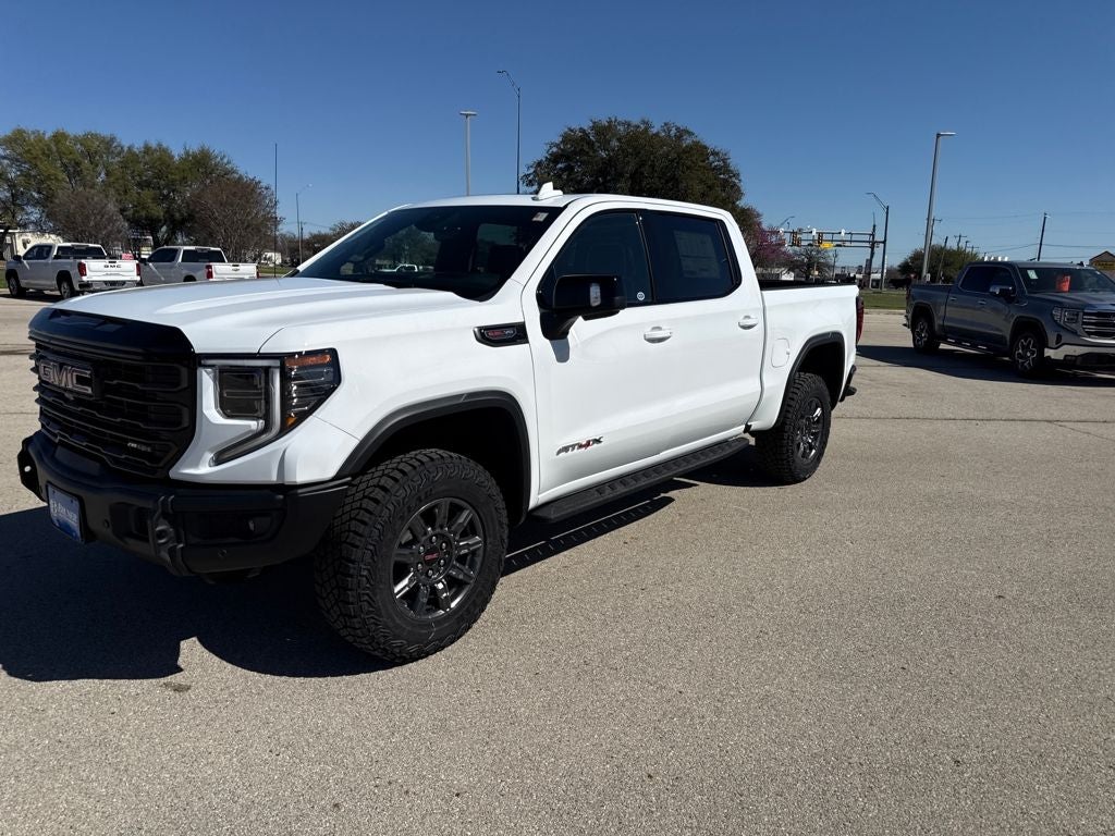 2026 GMC Sierra 1500 AT4X in Summit White — front three-quarter view